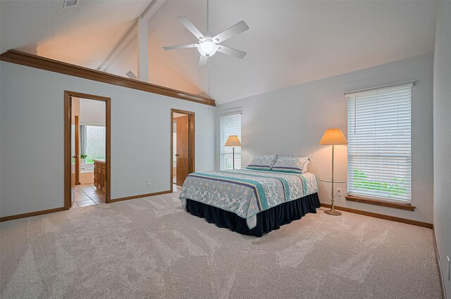 16218 Capri Dr, Jersey Village, TX 77040 - carpeted bedroom with baseboards, ensuite bath, beamed ceiling, ceiling fan, and high vaulted ceiling