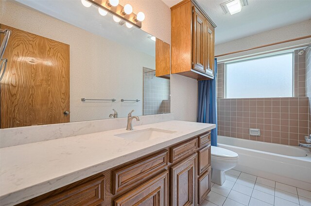 16218 Capri Dr, Jersey Village, TX 77040 - full bath with vanity, toilet, tile patterned floors, and shower / bath combo with shower curtain