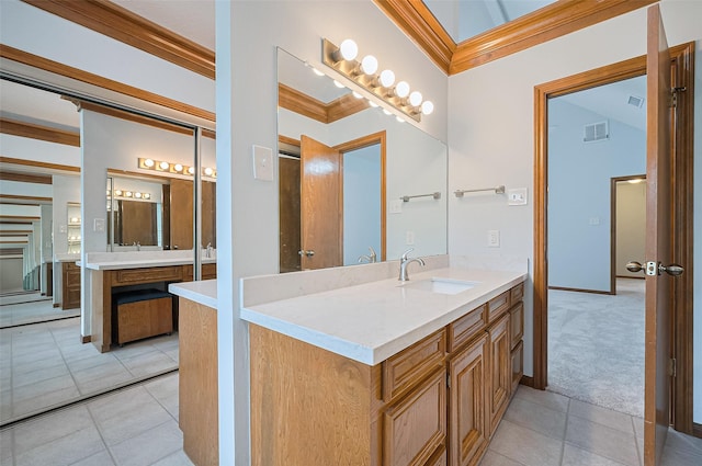 16218 Capri Dr, Jersey Village, TX 77040 - bathroom with vanity, tile patterned flooring, and ornamental molding