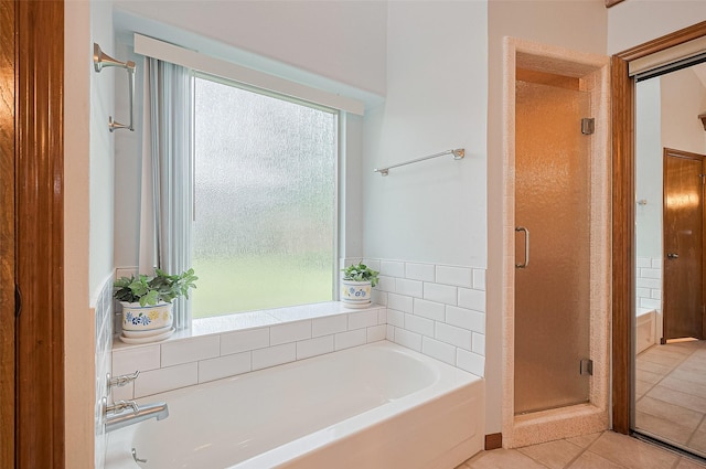 16218 Capri Dr, Jersey Village, TX 77040 - bathroom with a shower stall, a bath, and tile patterned flooring