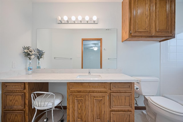 16218 Capri Dr, Jersey Village, TX 77040 - bathroom with vanity, toilet, and ceiling fan