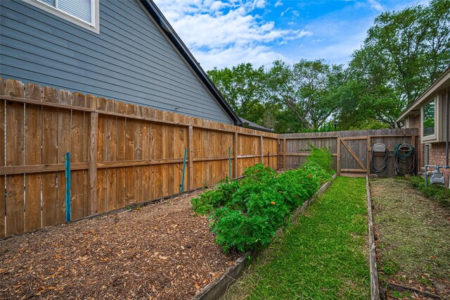 16218 Capri Dr, Jersey Village, TX 77040 - fenced backyard featuring a vegetable garden