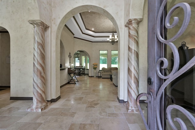 26118 Upper Beacon Pl, Montgomery, TX 77316 - foyer entrance featuring arched walkways, stone tile flooring, crown molding, and baseboards