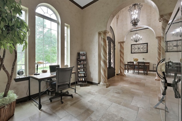 26118 Upper Beacon Pl, Montgomery, TX 77316 - home office featuring stone tile floors, arched walkways, ornate columns, a chandelier, and a high ceiling
