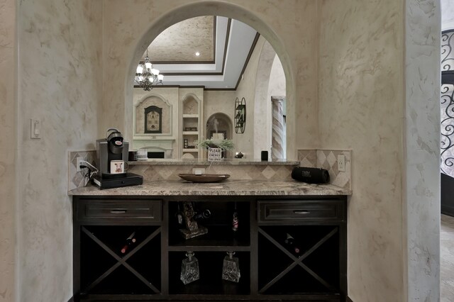 26118 Upper Beacon Pl, Montgomery, TX 77316 - bar area featuring arched walkways, ornamental molding, and a textured wall