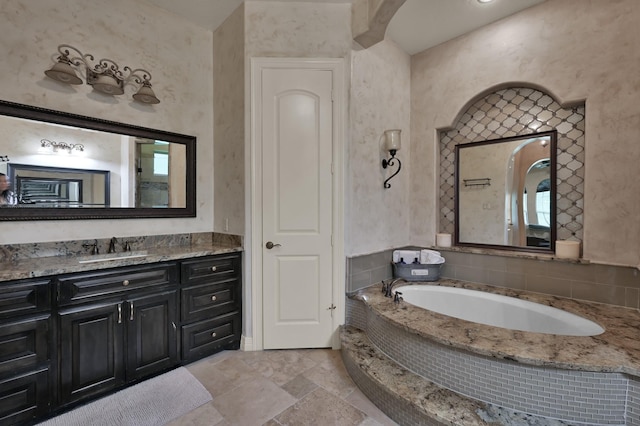 26118 Upper Beacon Pl, Montgomery, TX 77316 - bathroom featuring stone tile floors, a garden tub, vanity, and plenty of natural light