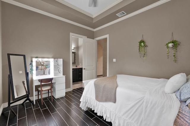 26118 Upper Beacon Pl, Montgomery, TX 77316 - bedroom with crown molding, connected bathroom, wood finish floors, and baseboards