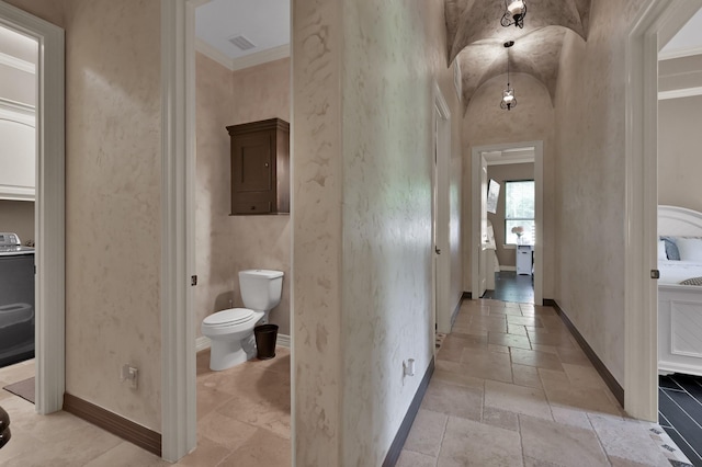 26118 Upper Beacon Pl, Montgomery, TX 77316 - hallway with stone tile flooring, baseboards, and ornamental molding
