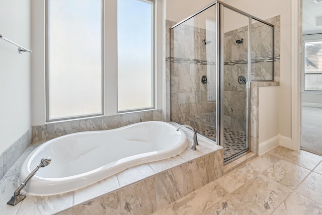 13906 Bell Valley Ct, Houston, TX 77059 - full bathroom featuring a stall shower, a bath, and baseboards