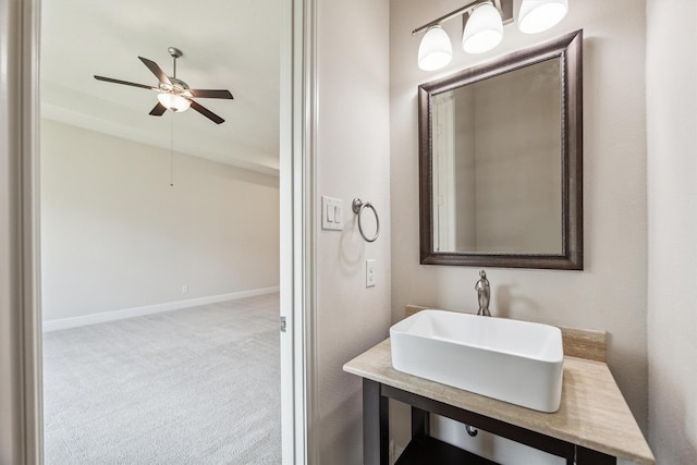 13906 Bell Valley Ct, Houston, TX 77059 - bathroom featuring a ceiling fan, a sink, and baseboards