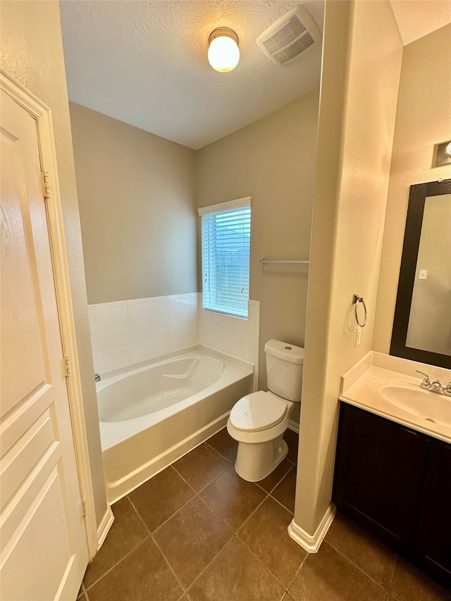 6010 Lovage Ave, Crosby, TX 77532 - full bath with tile patterned floors, a garden tub, toilet, and vanity