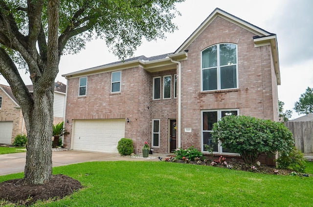 14411 Lawton Ridge Dr, Cypress, TX 77429 - view of front of home featuring driveway, a garage, and brick siding
