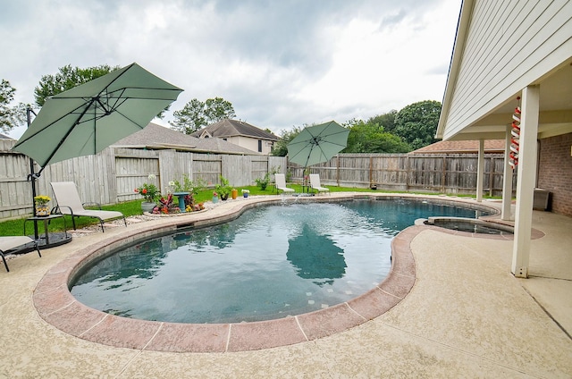 14411 Lawton Ridge Dr, Cypress, TX 77429 - view of pool featuring a patio area, a fenced backyard, and a pool with connected hot tub