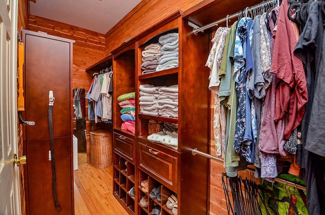 14411 Lawton Ridge Dr, Cypress, TX 77429 - walk in closet featuring light wood-style floors
