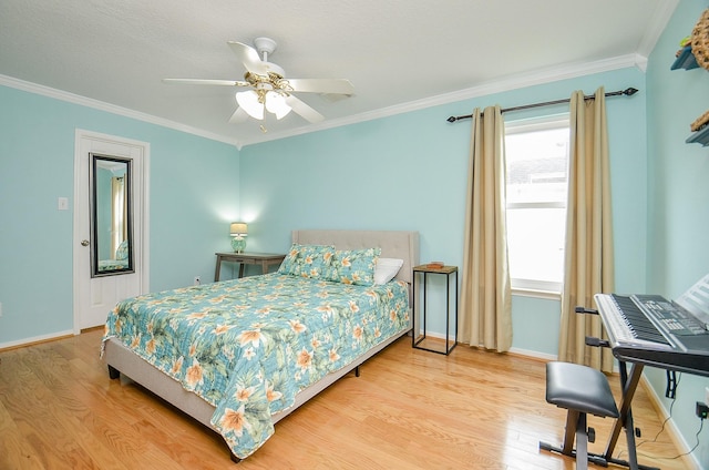 14411 Lawton Ridge Dr, Cypress, TX 77429 - bedroom with wood finished floors, multiple windows, crown molding, baseboards, and ceiling fan