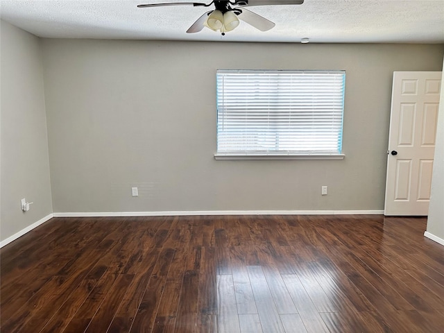 unfurnished room with ceiling fan, wood finished floors, and baseboards
