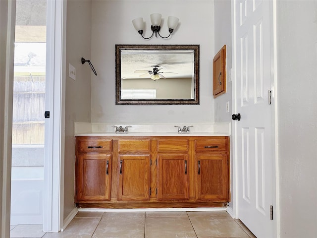 full bathroom with tile patterned flooring, double vanity, and baseboards