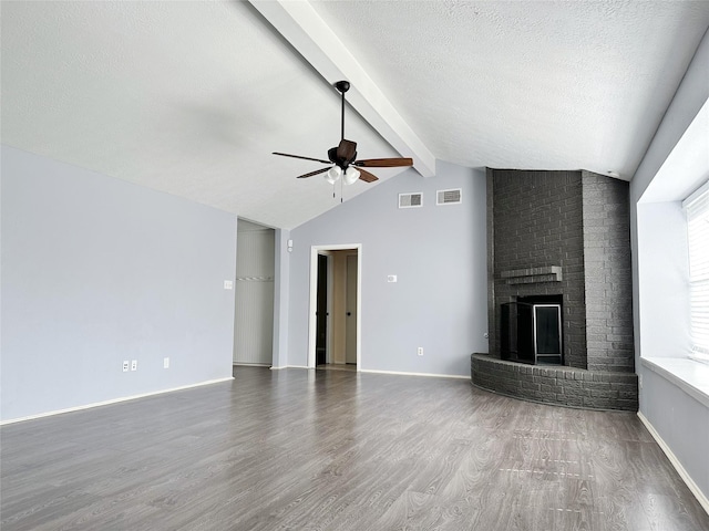 unfurnished living room featuring a ceiling fan, wood finished floors, a fireplace, a textured ceiling, and baseboards