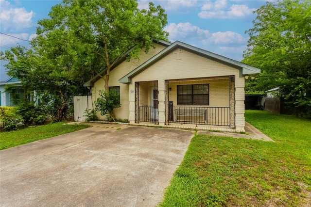817 Grunwald Heights Blvd, Rosenberg, TX 77471 - bungalow-style house with a porch, brick siding, and a gate