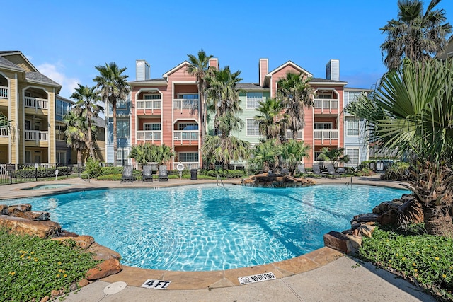 7000 Seawall Blvd Unit 1011, Galveston, TX 77551 - community pool featuring a hot tub