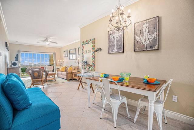 7000 Seawall Blvd Unit 1011, Galveston, TX 77551 - dining space with ornamental molding, a chandelier, a ceiling fan, light tile patterned floors, and baseboards
