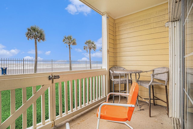 7000 Seawall Blvd Unit 1011, Galveston, TX 77551 - balcony with view of water and beach