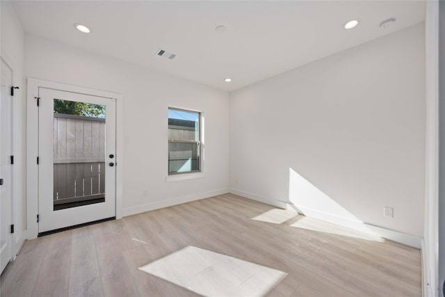 2528 Live Oak St, Houston, TX 77004 - entryway with light wood-type flooring, recessed lighting, and baseboards