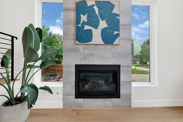 2202 Hewitt Dr, Houston, TX 77018 - detailed view of wood finished floors, baseboards, and a tile fireplace