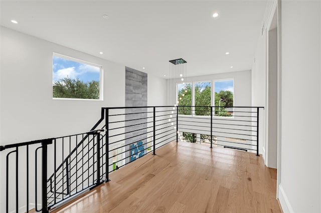 2202 Hewitt Dr, Houston, TX 77018 - corridor featuring wood finished floors, an upstairs landing, and recessed lighting