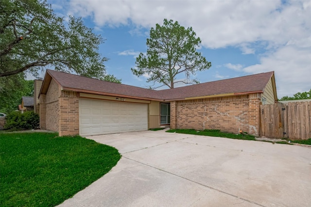 16250 Rancho Blanco Dr, Houston, TX 77083 - view of front of home featuring brick siding, a garage, and driveway