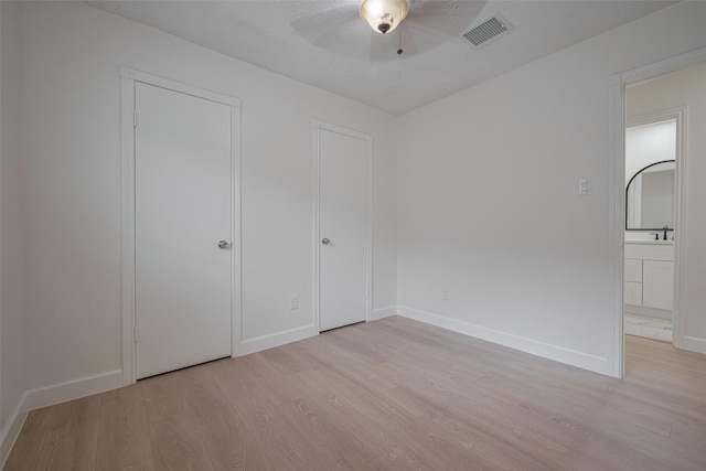 16250 Rancho Blanco Dr, Houston, TX 77083 - unfurnished bedroom featuring light wood-style floors, baseboards, and ceiling fan