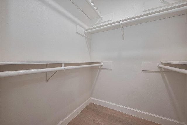 16250 Rancho Blanco Dr, Houston, TX 77083 - walk in closet with wood finished floors