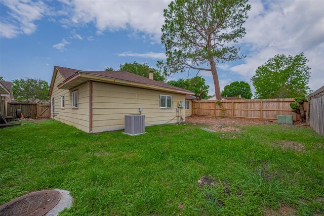 16250 Rancho Blanco Dr, Houston, TX 77083 - back of property featuring central AC
