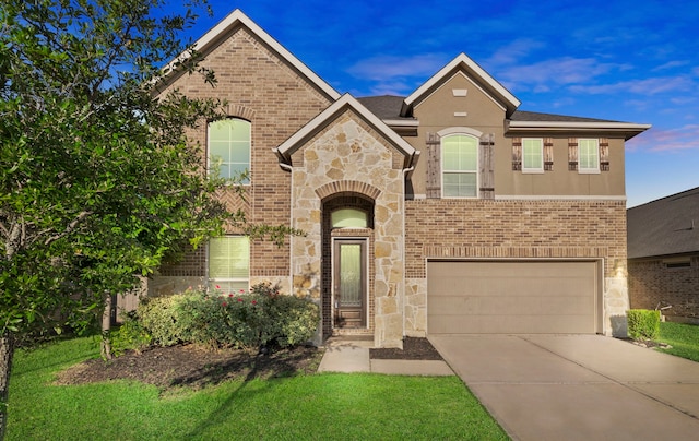 view of front of home with a garage, concrete driveway, stone siding, and brick siding