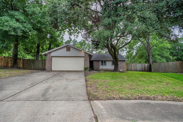 5102 Enchanted Timbers Dr, Humble, TX 77346 - ranch-style home featuring brick siding, a garage, and concrete driveway
