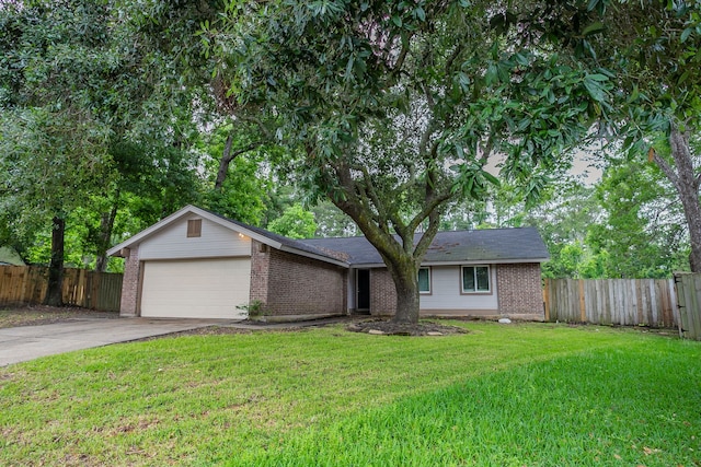 5102 Enchanted Timbers Dr, Humble, TX 77346 - view of front of home featuring brick siding, driveway, and an attached garage