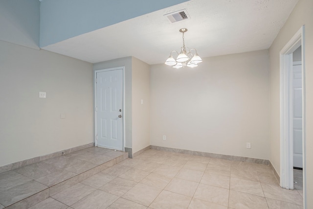 5102 Enchanted Timbers Dr, Humble, TX 77346 - unfurnished room featuring a chandelier, baseboards, and light tile patterned floors