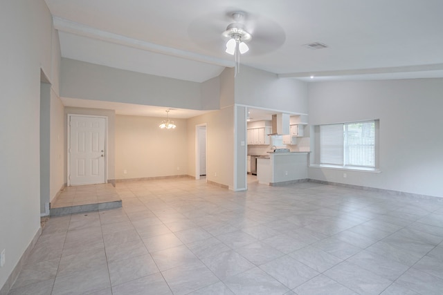 5102 Enchanted Timbers Dr, Humble, TX 77346 - unfurnished living room with ceiling fan, a chandelier, baseboards, light tile patterned flooring, and high vaulted ceiling