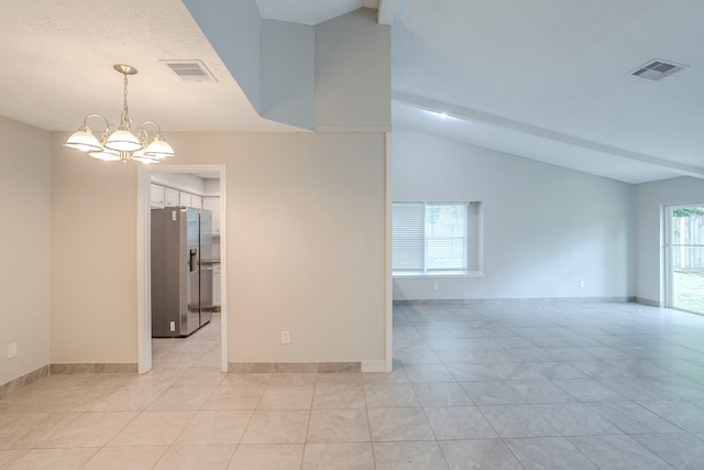 5102 Enchanted Timbers Dr, Humble, TX 77346 - spare room featuring a chandelier, light tile patterned flooring, lofted ceiling, and baseboards