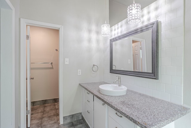 5102 Enchanted Timbers Dr, Humble, TX 77346 - bathroom with vanity, tasteful backsplash, and baseboards