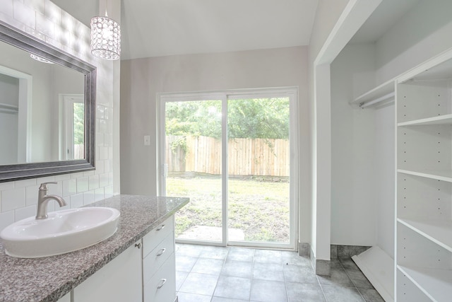 5102 Enchanted Timbers Dr, Humble, TX 77346 - bathroom with tasteful backsplash, tile patterned floors, and vanity