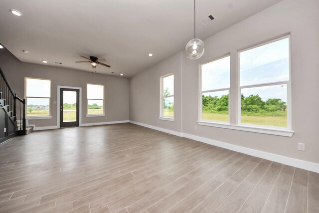 11141 Rd 5503, Cleveland, TX 77327 - unfurnished living room featuring baseboards, wood finished floors, ceiling fan, and recessed lighting