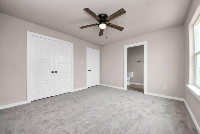 11141 Rd 5503, Cleveland, TX 77327 - unfurnished bedroom featuring carpet floors, baseboards, a closet, and multiple windows