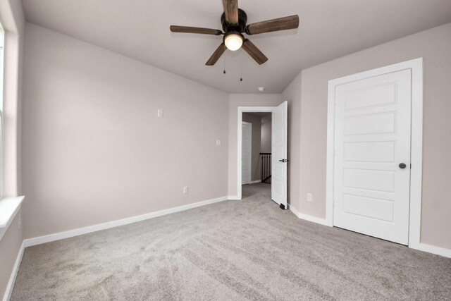 11141 Rd 5503, Cleveland, TX 77327 - unfurnished bedroom with carpet floors, baseboards, and a ceiling fan