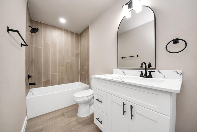 11141 Rd 5503, Cleveland, TX 77327 - bathroom featuring vanity, toilet, shower / bath combination, and wood finish floors