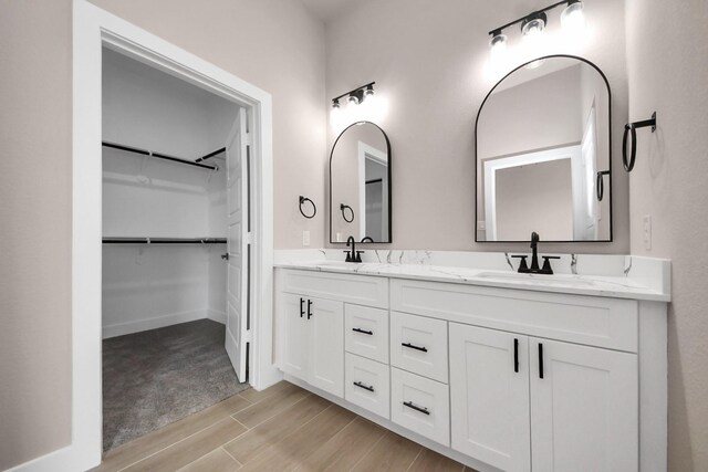 11141 Rd 5503, Cleveland, TX 77327 - full bath featuring double vanity, wood finished floors, and a spacious closet