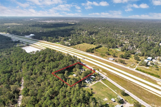 26472 Fm 1485th Rd, New Caney, TX 77357 - aerial view of property and surrounding area featuring a forest and property boundaries highlighted