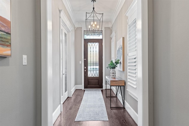 436 W 26th St, Houston, TX 77008 - entryway featuring a chandelier, dark wood-style flooring, ornamental molding, and baseboards