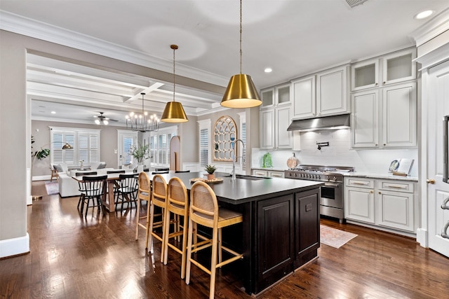 436 W 26th St, Houston, TX 77008 - kitchen with double oven range, a sink, under cabinet range hood, backsplash, and recessed lighting