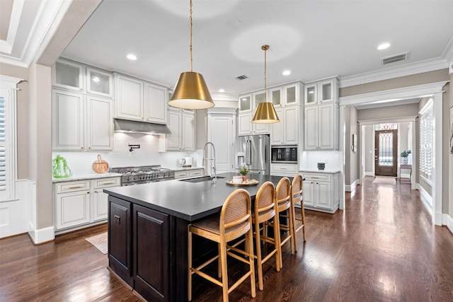 436 W 26th St, Houston, TX 77008 - kitchen with a sink, high quality appliances, an island with sink, backsplash, and crown molding